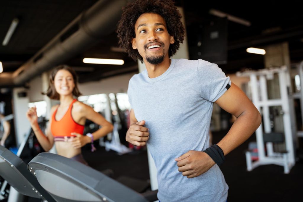 fit young man on treadmill demonstrating how to beat cravings for alcohol