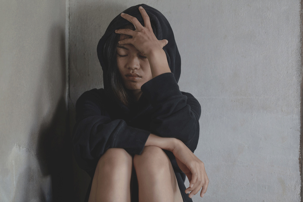 a young woman displays some warning signs of substance abuse and addiction