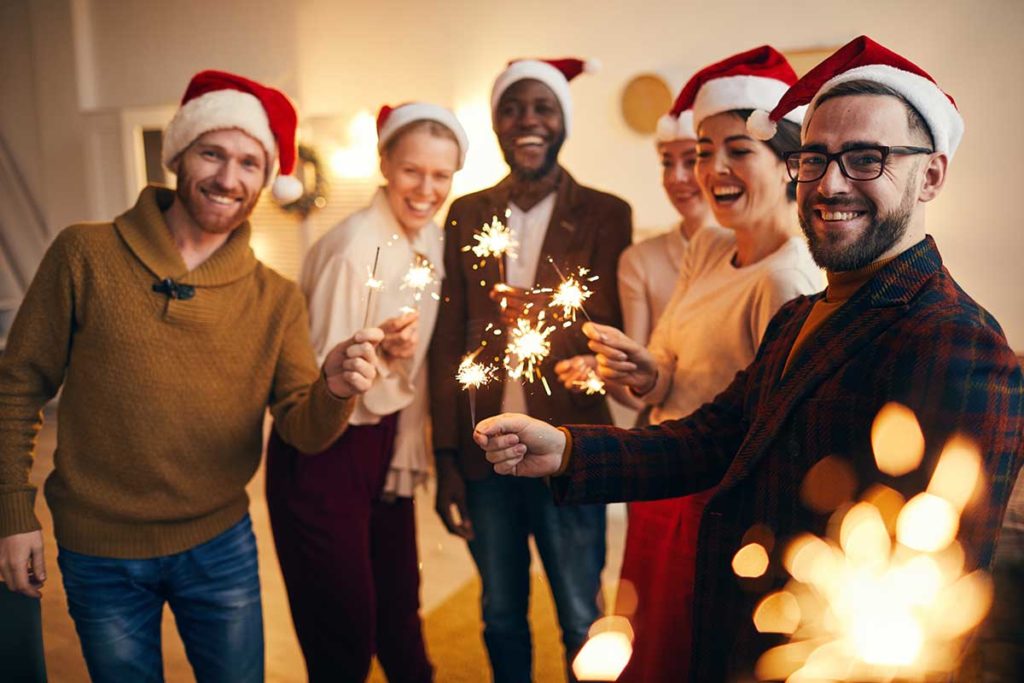 group of men and women dressed festively at a sober Christmas party