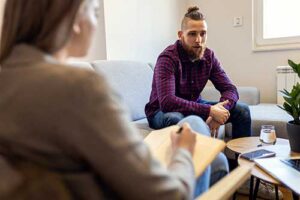 Person talking with their therapist during fentanyl addiction treatment