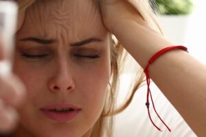 close up of woman who is angry and frustrated as she attempts to employ helpful tips for controlling anger